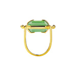Ring with a light green crystal