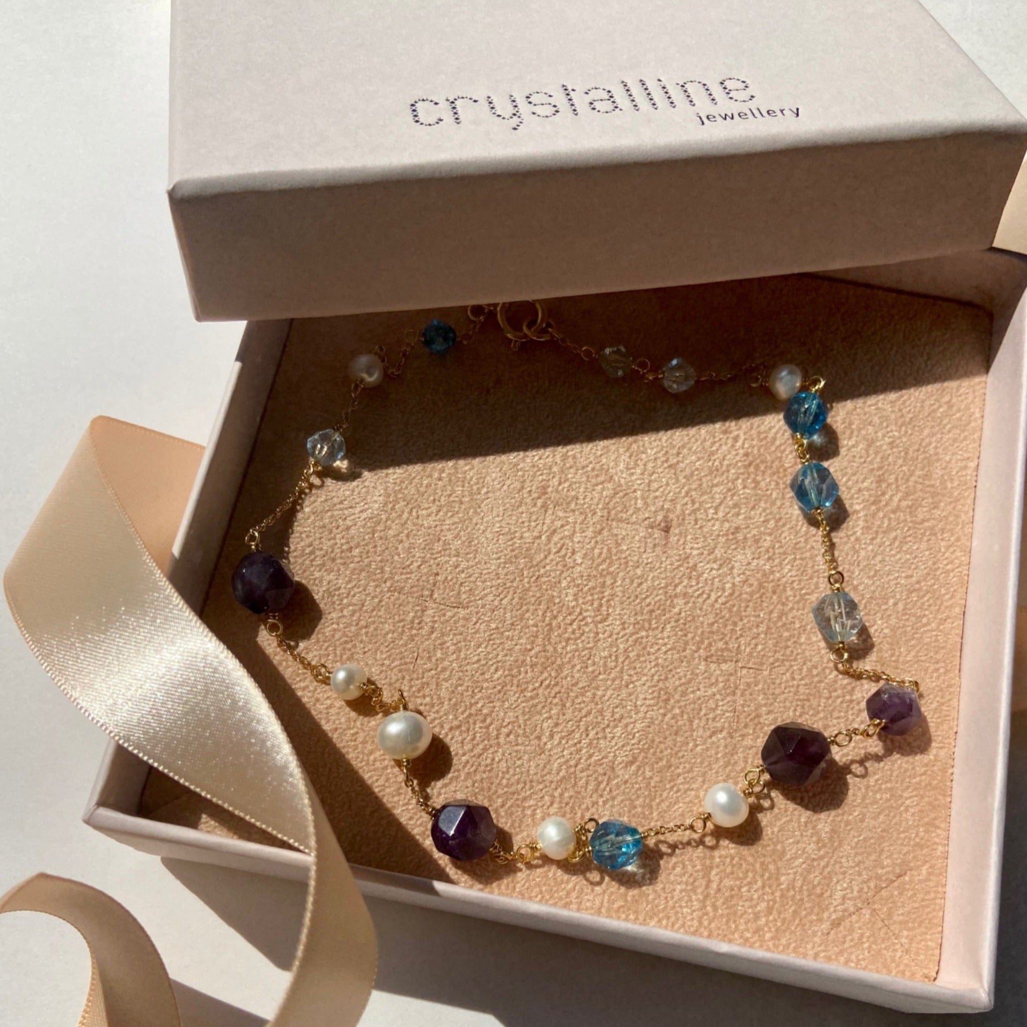 Necklace with cultured pearls, amethyst, blue crackle quartz and rock crystals